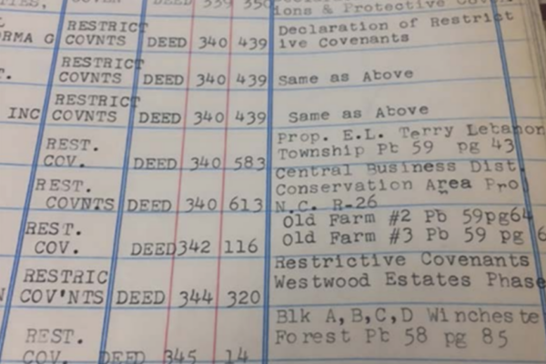 Page in a covenant restrictions deed book in Durham County Deeds Office, part of the chain of custody used to locate deeds with racial covenants. Photo: Hacking into History.